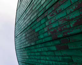 Curved Copper Close-up of the curved copper exterior of the NEMO Science Museum in Amsterdam.