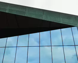 Soundscape Haven Helsinki Music Centre (Musiikkitalo) with green copper façade and glass frontage in central Helsinki.