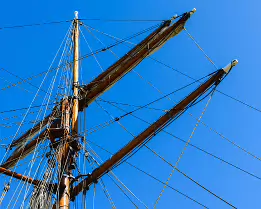 Maritime Ropes Tall ship mast and rigging against a clear blue summer sky in Helsinki.