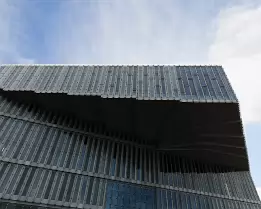 Library Overhang Cantilevered glass facade of the Deichman Bjørvika Library viewed from below in Oslo.