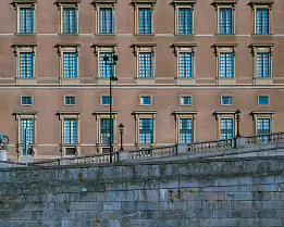 Royal Walls Exterior of Stockholm’s Royal Palace with rows of identical windows and a stone-lion balustrade in front.