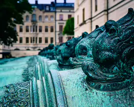 Bronze Beasts Historic cannons with sculpted bronze heads outside the Armémuseum in Stockholm.